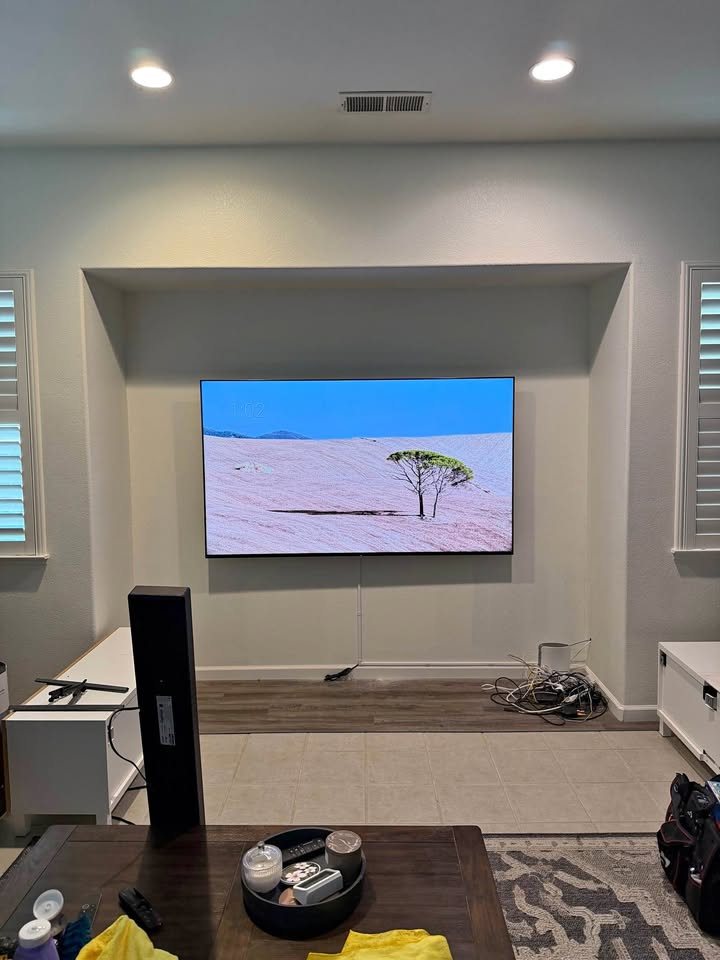 TV mounted inside a recessed wall niche in a living room